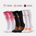Bundle of compression socks: pink FlowLine crew, black and white mid calf and knee high socks, studio shot