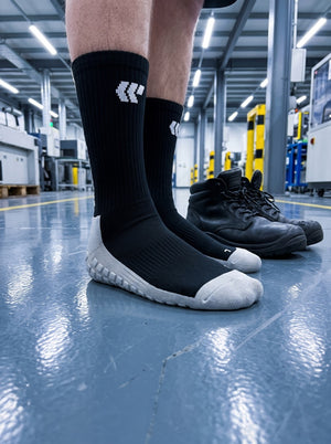 Trades socks on a factory floor